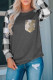 Camisa de màniga llarga a quadres gris amb butxaca davantera de lluentons