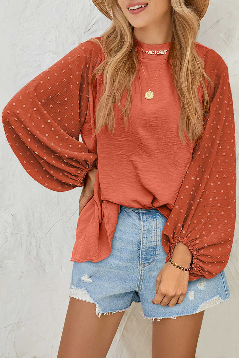 Brusa amb màniga de globus de punt suís de color taronja vermellós