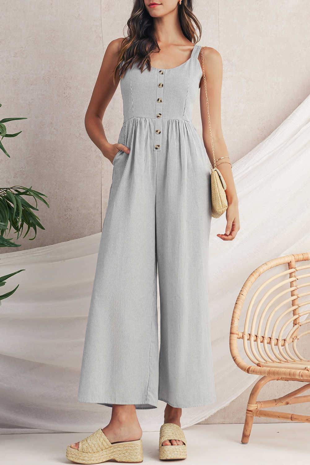 Mono de cama ample sense mànigues amb mig botons de ratlles negres