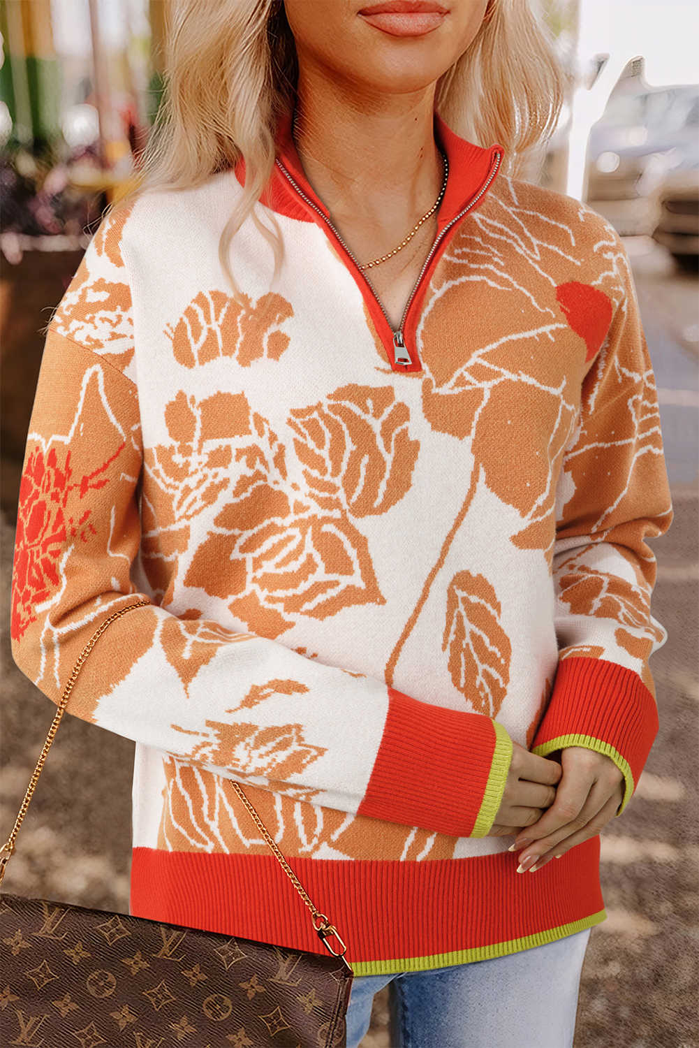 Jersei caqui amb detall de canalé i estampat floral amb coll i cremallera