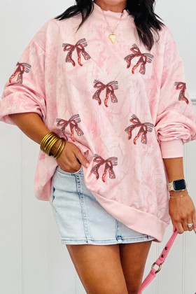 Dessuadora ampla de coll alt amb lluentons roses i llaç de Sant Valentí, tibat i pegat