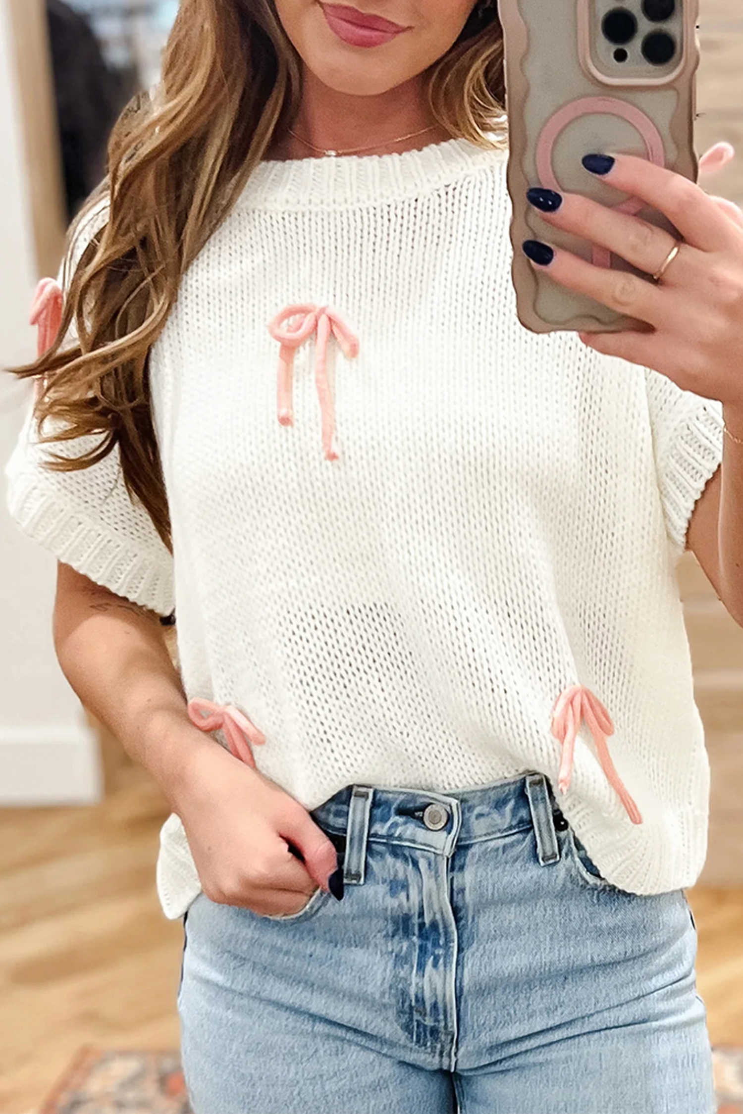 Jersei ample de màniga curta de punt blanc amb llaç en contrast