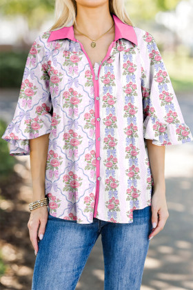 Camisa amb botons i rivets de blocs de color morats i flors en contrast