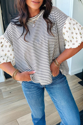 Top ample de coll rodó amb màniga bufada i franja floral negra